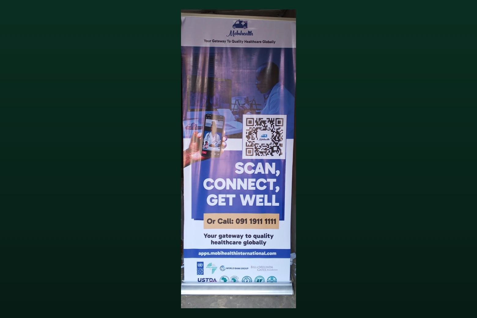 Large-format rollup banner professionally printed for a healthcare client, backed by UNDP, World Bank Group, and Gates Foundation partnerships