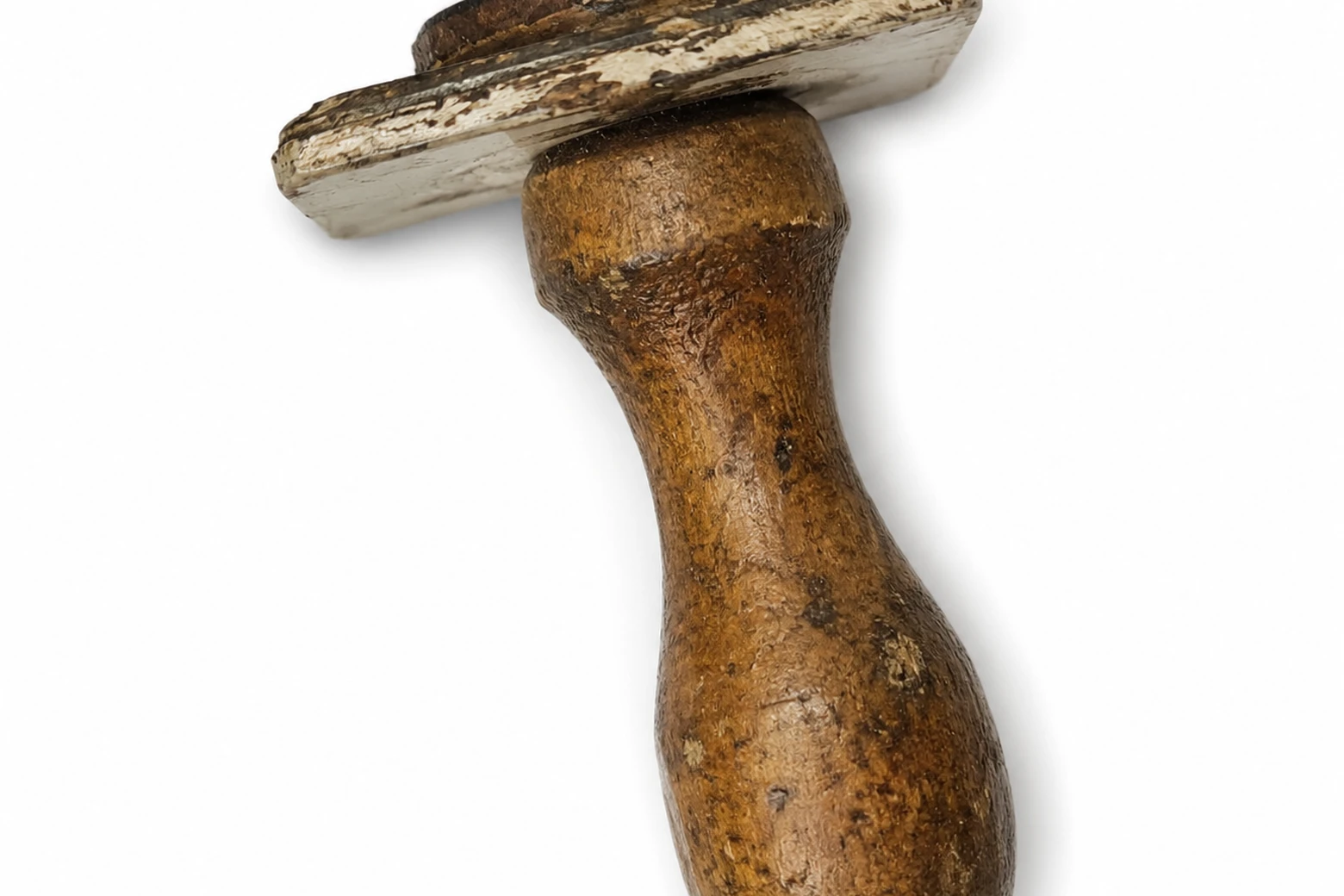 A worn, dirtied wooden office stamp with a faded, deteriorating imprint pad